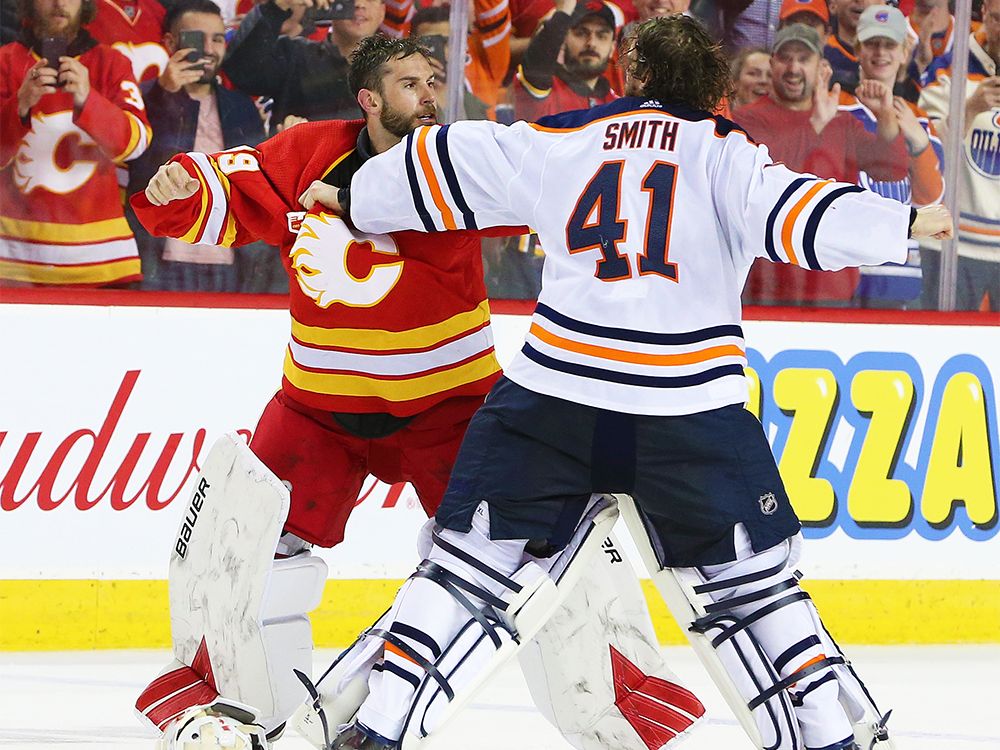 Calgary Flames' Matthew Tkachuk delivers huge hit on Edmonton Oilers' Zack  Kassian, sparking brawl