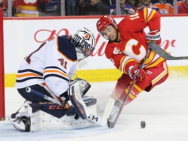 The Calgary Flame Derek Ryan comes close in a quick break-away against Edmonton Oilers goalie Mike Smith during NHL action in Calgary on Saturday, February 1, 2020.