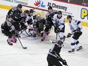 The Calgary Hitmen and Winnipeg Ice pack around Hitmen goaltender Brayden Peters during the TELUS Be Brave #endbullying game on Thursday, February 27, 2020.  Gavin Young/Postmedia