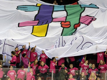 School children pass a giant end bullying flag while the Calgary Hitmen play the Winnipeg Ice during the TELUS Be Brave #endbullying game on Thursday, February 27, 2020.  Gavin Young/Postmedia