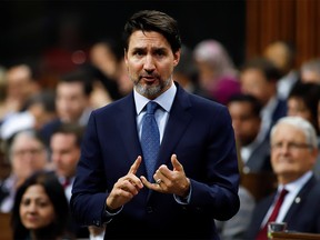 Canada's Prime Minister Justin Trudeau gestures as he speaks in parliament during Question Period in Ottawa, Ontario, Canada February 18, 2020.  REUTERS/Patrick Doyle ORG XMIT: GGG-OTW124