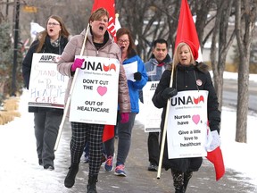 Members of the United Nurses of Alberta march outside the Foothills Hospital in Calgary on Thursday, February 13, 2020. Their goal was to show support for publicly delivered health care and all the front-line workers. Jim Wells/Postmedia