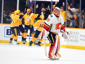 A dejected David Rittich leaves the ice after giving up the overtime goal to Nashville Predators centre Mikael Granlund on Thursday, Feb. 27, 2020.