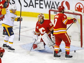 Nashville Predators put one past Flames goaltender Cam Talbot in the first period at the Scotiabank Saddledome on Thursday, Feb. 6, 2020.
