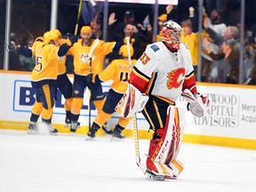 Feb 27, 2020; Nashville, Tennessee, USA; Calgary Flames goaltender David Rittich (33) skates off the ice after allowing the game-winning goal to Nashville Predators center Mikael Granlund (64) in overtime at Bridgestone Arena. Mandatory Credit: Christopher Hanewinckel-USA TODAY Sports ORG XMIT: USATSI-405984