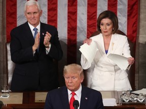 U.S. House Speaker Rep. Nancy Pelosi (D-CA) rips up pages of the State of the Union speech after U.S. President Donald Trump finishes his State of the Union speech in the chamber of the U.S. House of Representatives on Feb. 4, 2020, in Washington, D.C. (Photo by /)