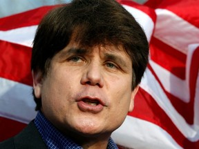 Former Illinois Governor Rod Blagojevich makes a statement to reporters outside his Chicago home one day before reporting to federal prison in Colorado to serve a 14-year sentence for corruption, on March 14, 2012. President Donald Trump on Tuesday said he had commuted the sentence of Blagojevich.