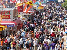 Crowds enjoy the warm weather at the Calgary Stampede in Calgary, Alberta on July 7, 2012.