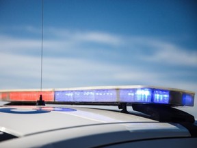 RCMP logo and police cars outside of Calgary.