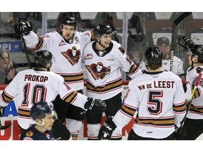 The Hitmen celebrate one of their eight goals on the evening in an 8-1 thumping of the Regina Pats at Scotiabank Saddledome in Calgary on Wednesday night. Photo by Brendan Miller/Postmedia.
