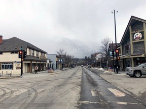 A very quiet main street in Canmore on March 21, as global pandemic COVID-19 shuts down businesses and governments warm people to stay at home in an attempt to stop the spread of the deadly virus. Photo Marie Conboy.