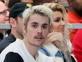 Justin Bieber (L) and Tori Kelly (R) attend an event honoring Sir Lucian Grainge with a star on the Hollywood Walk of Fame on January 23, 2020 in Hollywood, California.