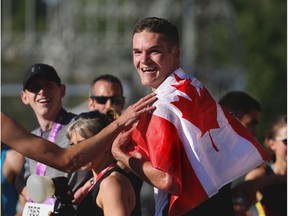 Calgary's Trevor Hofbauer was all smiles after winning the Centaur Subaru Half Marathon event at the Scotiabank Calgary Marathon at Stampede Park on Sunday May 27, 2018. Gavin Young/Postmedia
