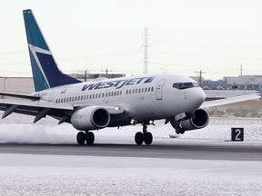 A WestJet Boeing 737 lands at Calgary International Airport on Thursday, January 23, 2020.