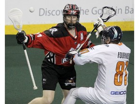 Roughneck Curtis Dickson and Riptide Ryan Fournier fight for a lose ball during the 1st half of action as the Calgary Roughnecks take on the New York Riptide at the Saddledome.  Saturday, February 8, 2020. Brendan Miller/Postmedia