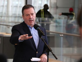 Premier Jason Kenney speaks with media at the Calgary International Airport before flying to Ottawa to attend the First Ministers' Meeting on Wednesday, March 11, 2020. Gavin Young/Postmedia