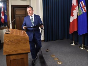 Premier Jason Kenney walks up to the podium to declare a state of public health emergency during a news conference at the Alberta Legislature in Edmonton, March 17, 2020. Ed Kaiser/Postmedia