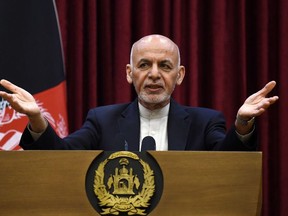 Afghan President Ashraf Ghani gestures as he speaks during a press conference at the presidential palace in Kabul on March 1, 2020.