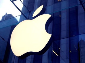 The Apple Inc. logo is seen hanging at the Apple store on 5th Avenue in Manhattan, N.Y., Oct. 16, 2019.