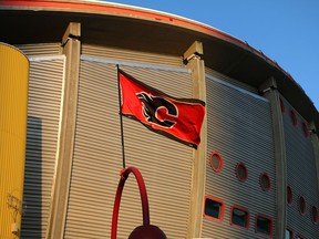 The sun sets on the Scotiabank Saddledome in this file photo. The NHL has suspended play due to the coronavirus.