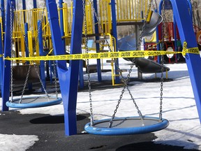 Bowness Park has all their playgrounds closed due to the COVID-19 virus as many families took to the pathways in Calgary on Monday, March 23, 2020. Darren Makowichuk/Postmedia