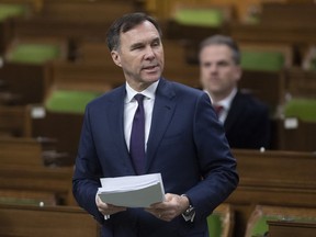 Minister of Finance Bill Morneau introduces a government bill during a special sitting of Parliament in the House of Commons Wednesday March 25, 2020 in Ottawa.