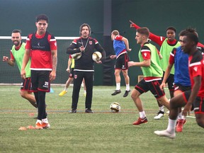 Cavalry FC coach/ GM Tommy Wheeldon Jr (C) oversees a drill during the first day of training camp for the CPL team at the Macron Performance Centre in Calgary on Monday, March 2, 2020. Jim Wells/Postmedia