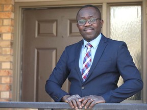 Victor Aduayi poses at his southwest Calgary home on Friday, March 27, 2020. Foreign doctors without full qualifications are frustrated at being sidelined during the COVID-19 crisis. Jim Wells/Postmedia