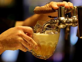 A bartender pours a glass of beer inside of a new conceptual pub by Plzensky Prazdroj (Pilsner Urquell) brewery called Plzenka in Prague, Czech Republic, May 6, 2019.