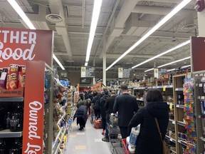 Long lines at a downtown Calgary grocery store in mid-March.