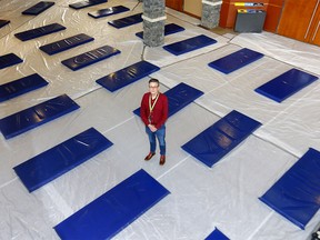 Pastor James Paton from the First Alliance Church has set up bed areas in the Church to help clients from the Mustard Seed in social distancing in Calgary on Monday, March 23, 2020. Darren Makowichuk/Postmedia