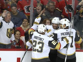 Vegas Golden Knights celebrate a late goal against the Calgary Flames at the Saddledome on Sunday, March 8, 2020.