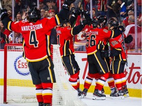 Mar 8, 2020; Calgary, Alberta, CAN; Calgary Flames left wing Matthew Tkachuk (19) celebrates his goal with teammates against the Vegas Golden Knights during the third period at Scotiabank Saddledome. Mandatory Credit: Sergei Belski-USA TODAY Sports ORG XMIT: USATSI-406054