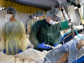 Medical staff tend to COVID-19 patients at the Samaritan’s Purse emergency field hospital in Cremona, Italy.