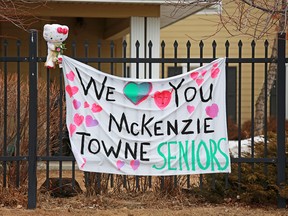 A sign of support for seniors quarantined in the McKenzie Towne Continuing Care Centre hangs outside the facility on Saturday, March 28, 2020.