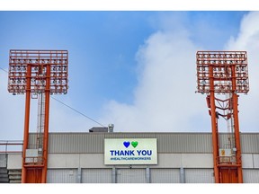 Signs on the McMahon Stadium send a thank-you to the health workers during the Coronavirus pandemic earlier this month. Photo by Azin Ghaffari/Postmedia.