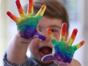 In this undated handout photo issued on April 22, 2020 by Kensington Palace and taken by Catherine, Duchess of Cambridge, Prince Louis paints a rainbow with watercolors earlier this month.