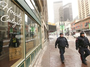Calgary police officers patrol Stephen Avenue on Thursday, April 2, 2020. Police were watching for increased break-ins during the COVID-19 pandemic.