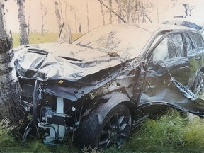The crashed car of 60-year-old Horst Stewin who was shot in the left side of the head by someone in a passing car is shown in this undated court handout photo. A sentencing hearing is scheduled for a teen who shot a German tourist in 2018.