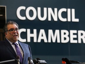 Calgary Mayor Naheed Nenshi speaks to reporters outside council chambers on Monday, April 6, 2020. Councillors are allowing taxpayers to defer property tax payments. Columnist Chris Nelson says they should offer to cut their own salaries.