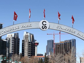 An overhead sign at Stampede Park frames part of the city of Calgary skyline on Thursday, April 16, 2020. The 2020 version of the Calgary Stampede is up in the air due to the COVID-19 crisis. Jim Wells/Postmedia