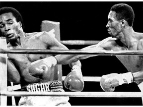 Tommy Hearns drives Sugar Ray Leonard into the ropes during the first round of their 1981 fight.