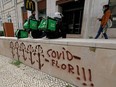 Uber Eats workers wait for orders as the spread of COVID-19 continues, in Lisbon, Portugal, April 25, 2020.