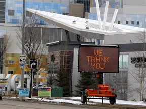 A sign that reads "We thank you health care workers" is seen along Seton Blvd. SE. in front of the South Health Campus.  Wednesday, April 15, 2020. Brendan Miller/Postmedia