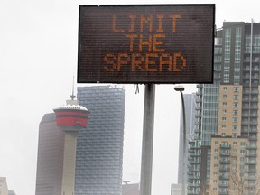 An electronic sign is displayed along Macleod Tr. SE. entering downtown as Calgary endures the COVID-19 pandemic.  Tuesday, April 7, 2020.
