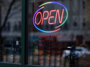 Pictured is a neon open business sign on Friday, May 1, 2020.