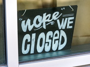 Pictured is a closed sign seen at Shiki Menya restaurant in Bridgeland on Wednesday, May 13, 2020.