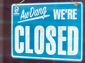 Pictured is a closed sign seen at Bike and Brew in Bridgeland on Wednesday, May 13, 2020.