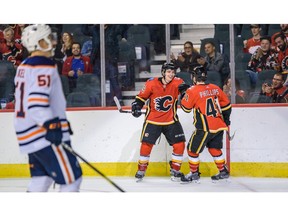 The Calgary Flames' Matthew Phillips celebrates a goal assisted by Jakob Pelletier against the Edmonton Oilers during the Battle of Alberta prospects game at Scotiabank Saddledome in Calgary on Tuesday, Sept. 10, 2019. The Flames won 3-1. Azin Ghaffari/Postmedia Calgary