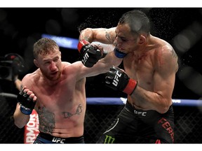 Justin Gaethje (left) punches Tony Ferguson in their interim lightweight title fight during UFC 249 at VyStar Veterans Memorial Arena on May 9, 2020, in Jacksonville, Fla. Douglas P. DeFelice/Getty Images